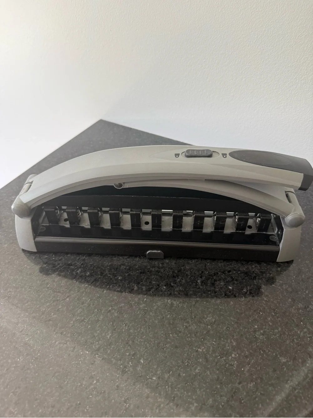 Staples Arc desktop paper punch in Gray and Black